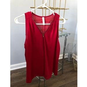 Red zip up blouse.
